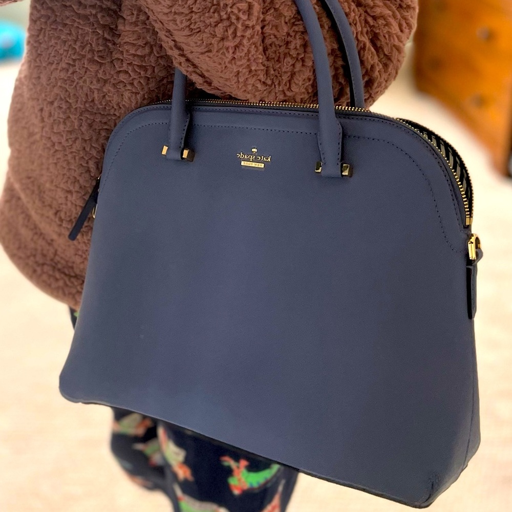 Kate Spade purse NWOT. It’s been sat in closet never used - needs loving home